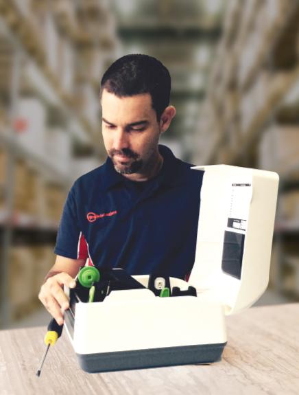 printer technician fixing barcode printer